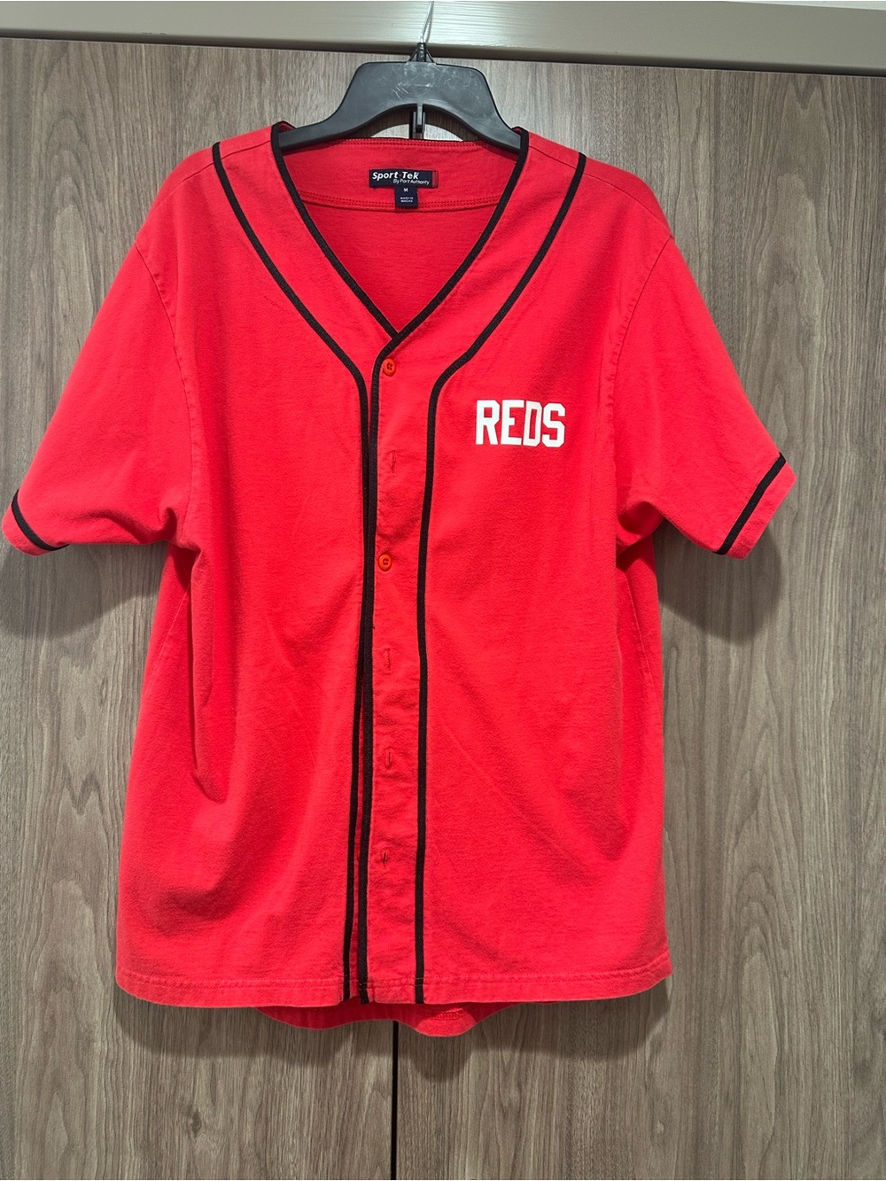 Sport-Tek Red Baseball Jersey with Black Trim and 'REDS' Lettering